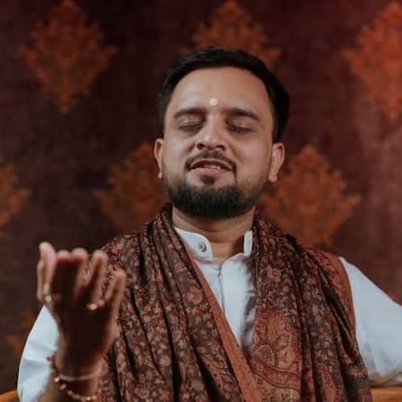 Dharamik Shri seated in meditation